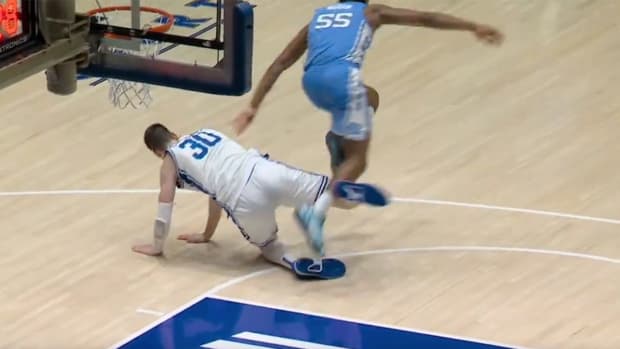 Duke center Kyle Filipowski appears to trip UNC forward Harrison Ingram.